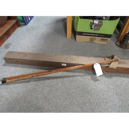 318 - A vintage spilt cane three section fly fishing rod with spare top section in original wooden case