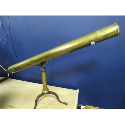 337 - An antique brass telescope on brass tripod base