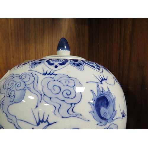 346 - A Oriental blue and white jar and cover with character mark to base