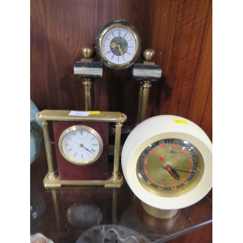 355 - Three collectible clocks to include a retro Russian ball clock, a heavy brass William Widdop mantle ... 