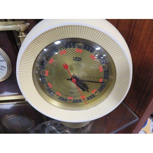 355 - Three collectible clocks to include a retro Russian ball clock, a heavy brass William Widdop mantle ... 