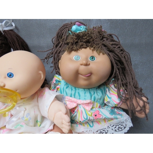 73 - Three vintage Cabbage Patch Dolls together with another doll (4)