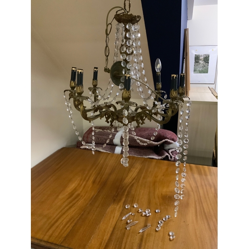 831 - A 20th century crystal eight branch chandelier - converted for electricity, App. H 70 cm