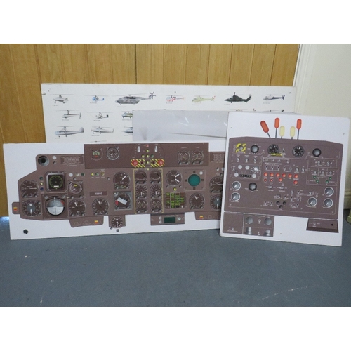 30 - A selection of military posters to include a helicopter cockpit training board, various aircraft pos... 