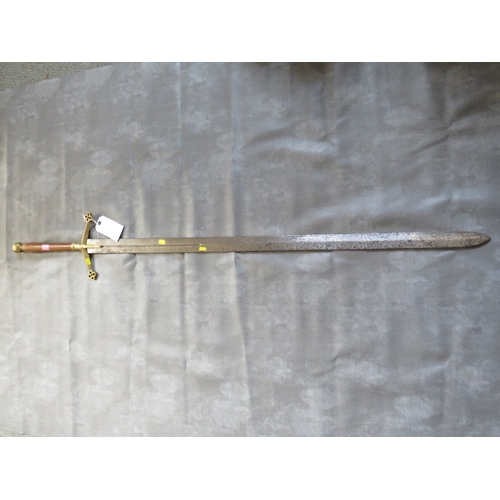 28 - A REPLICA MEDIEVAL TWO HANDED SWORD, turned wood grip, brass pommel and brass cross guard, with quat... 