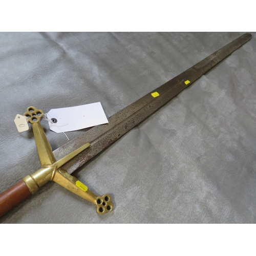 28 - A REPLICA MEDIEVAL TWO HANDED SWORD, turned wood grip, brass pommel and brass cross guard, with quat... 