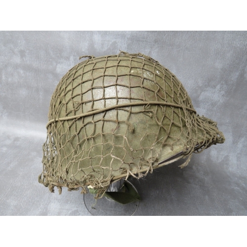 60 - A US ARMY VIETNAM ERA TIN HELMET AND LINER