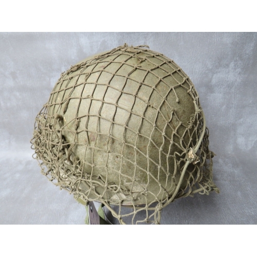 60 - A US ARMY VIETNAM ERA TIN HELMET AND LINER