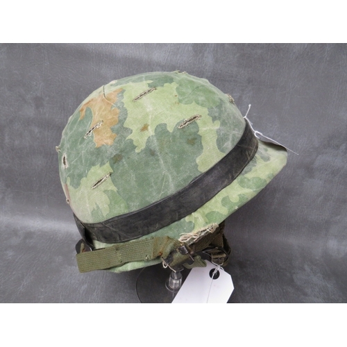 67 - A US WW2 M1 HELMET (FRONT SEAM), with 1961 Air Borne liner, with camo cover