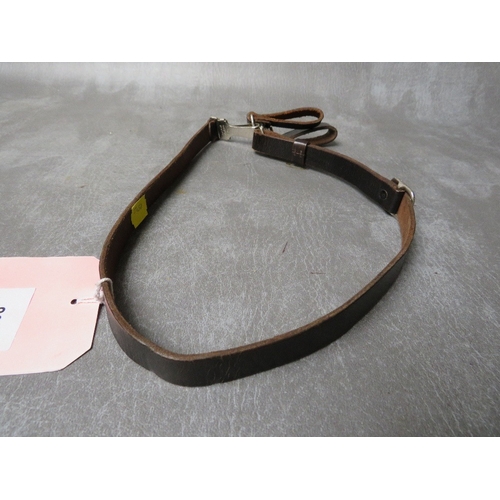 82 - A 1988 DATED GERMAN OFFICERS CROSS STRAP, the fittings with RZM marks and makers mark for Assman