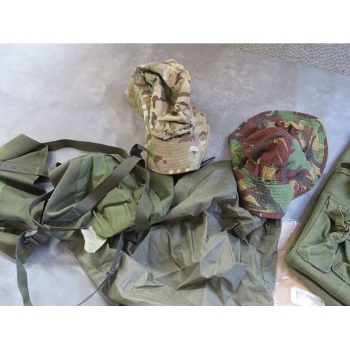 83 - A TRAY OF ASSORTED WEBBING AND COVERS, to include bags, tropical combat hat etc.