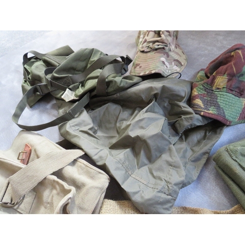 83 - A TRAY OF ASSORTED WEBBING AND COVERS, to include bags, tropical combat hat etc.