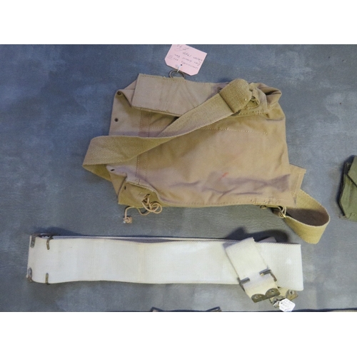 187 - A QUANTITY OF WWII ERA BELTS AND POUCHES ETC., to include a ladies gas mask, hand bag and a 1944 dat... 