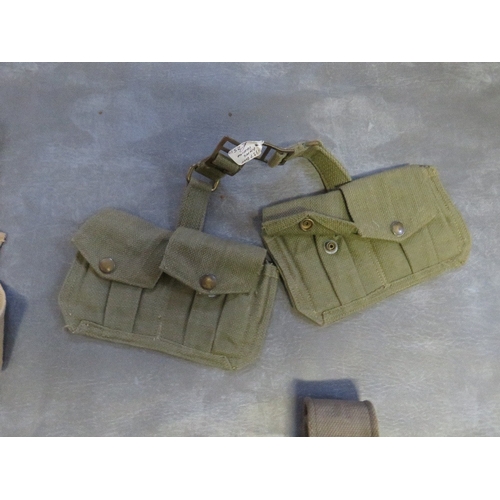 187 - A QUANTITY OF WWII ERA BELTS AND POUCHES ETC., to include a ladies gas mask, hand bag and a 1944 dat... 