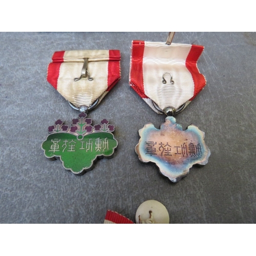 204 - TWO CASED JAPANESE ORDER OF THE RISING SUN 7TH CLASS (2)