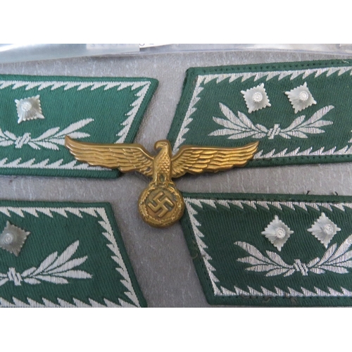 266 - A COLLECTION OF GERMAN CUSTOMS OFFICERS COLLAR PATCHES, and a brass breast / cap eagle