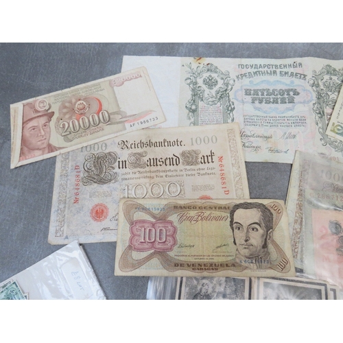 285 - FOUR WW2 GERMAN DEATH CARDS, and a small quantity of German stamps and a quantity of world banknotes