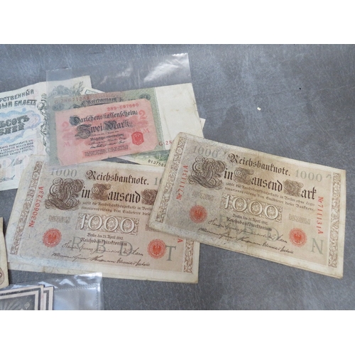 285 - FOUR WW2 GERMAN DEATH CARDS, and a small quantity of German stamps and a quantity of world banknotes