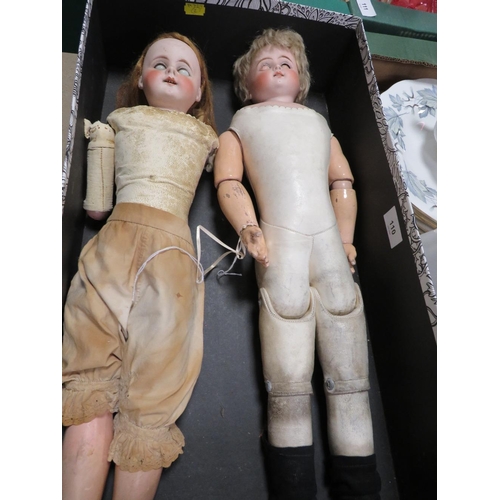 110 - Two late 18th /early 19th century leather bodied dolls with porcelain arms and legs one marked verso... 