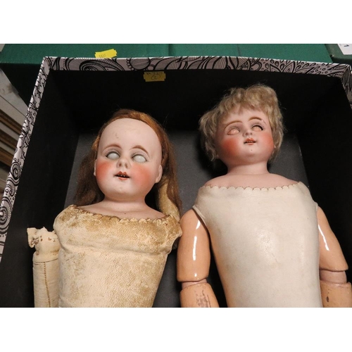 110 - Two late 18th /early 19th century leather bodied dolls with porcelain arms and legs one marked verso... 