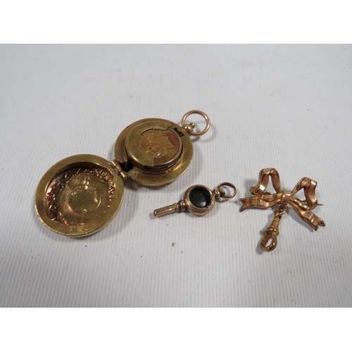 416 - An antique pocket watch key, sovereign case etc