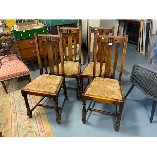 771 - A set of four oak dining chairs