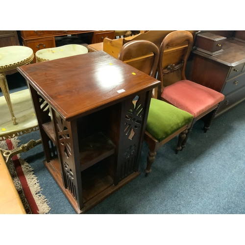 776 - A reproduction mahogany revolving bookcase together with two Victorian mahogany chairs