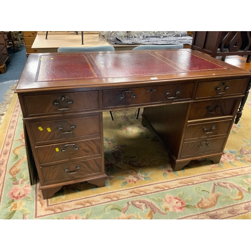 801 - A reproduction leather topped twin pedestal desk W 137 cm