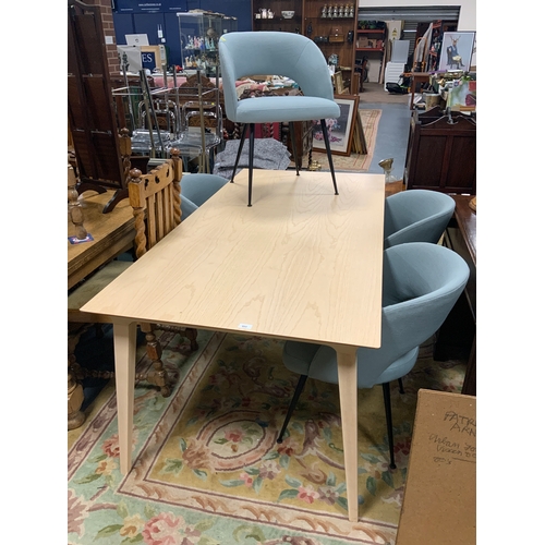 802 - A modern dining table with four teal upholstered chairs