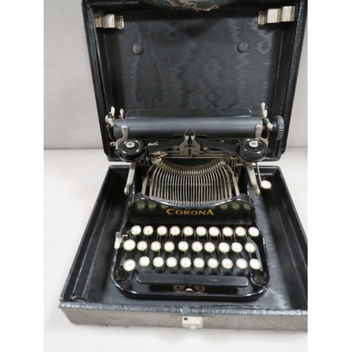 333 - An antique portable Corona cased typewriter