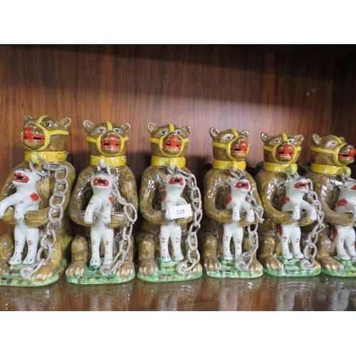 335 - Six reproduction bear tea pots