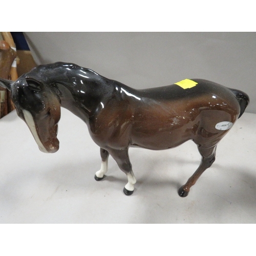 355 - A Beswick horse together with a country artists flying duck display