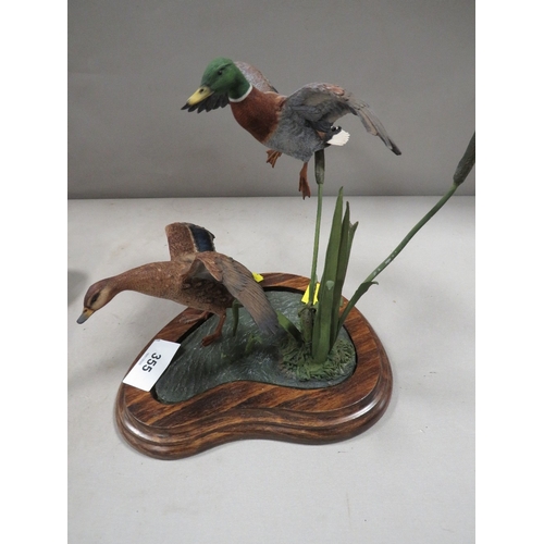 355 - A Beswick horse together with a country artists flying duck display