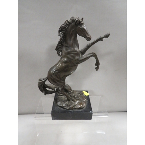 365 - A cast bronze type figure of a rearing horse on a plinth stamped PW 52316