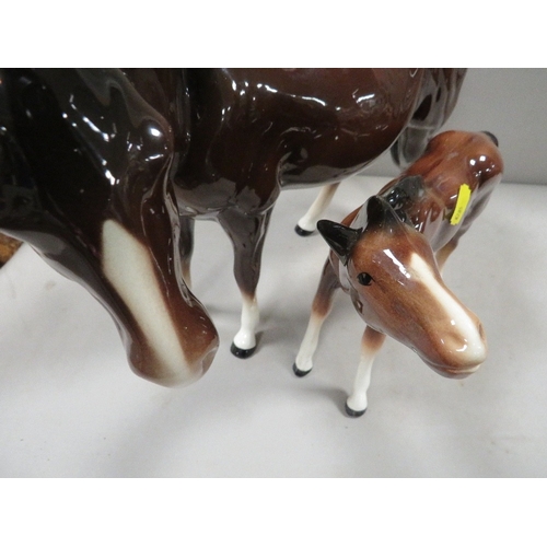 369 - Two Melba ware horses together with a boxed Doulton figurine