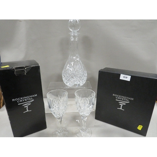 410 - A Rockingham Crystal cut glass decanter and two glasses