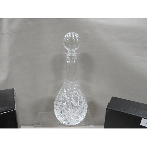 410 - A Rockingham Crystal cut glass decanter and two glasses