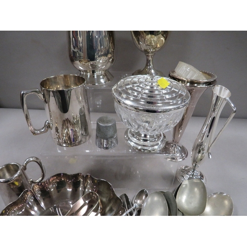 411 - A small tray of silver plated ware