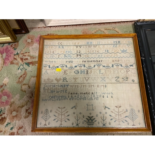 24 - A framed sampler dated 1825 together with a floral tapestry, floral silk work and an eastern silk wo... 