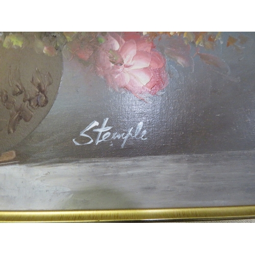 46 - A modern gilt framed still life oil on canvas, depicting a vase of flowers, signed lower right