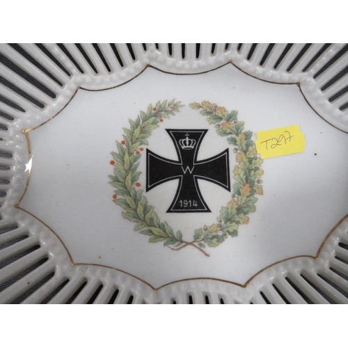 140 - A German WW1 porcelain basket, the centre decorated with an iron cross medal in wreath