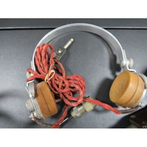 142 - Two pairs of WW11 radio headphones marked 5965-99-100, the first dated 1939, the second 1940, the la... 