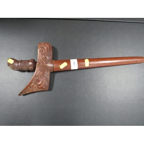 145 - An early 20th century Javanese Kris dagger, with finely carved hardwood grip and scabbard