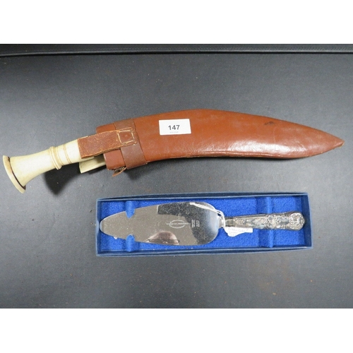 147 - A Kukri knife together with a silver handle cake slice