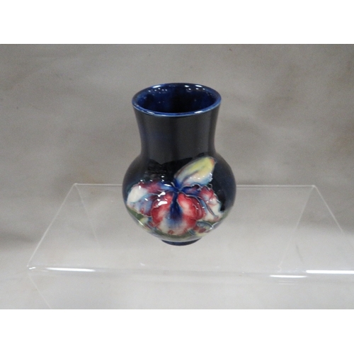 316 - A small Moorcroft vase with signed label to base