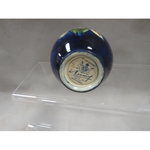 316 - A small Moorcroft vase with signed label to base