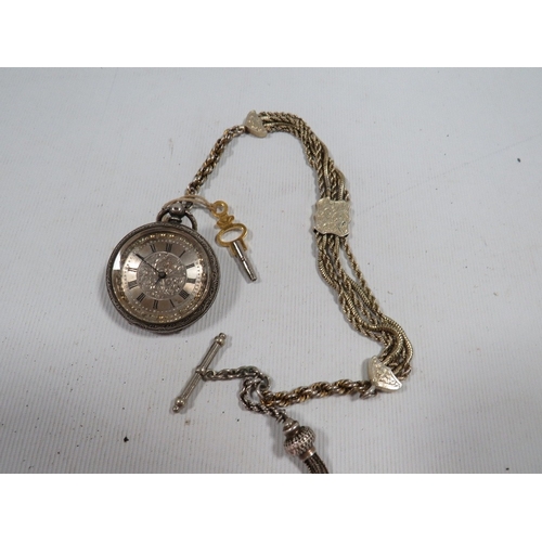 334 - A Victorian ladies silver pocket and albertina watch chain