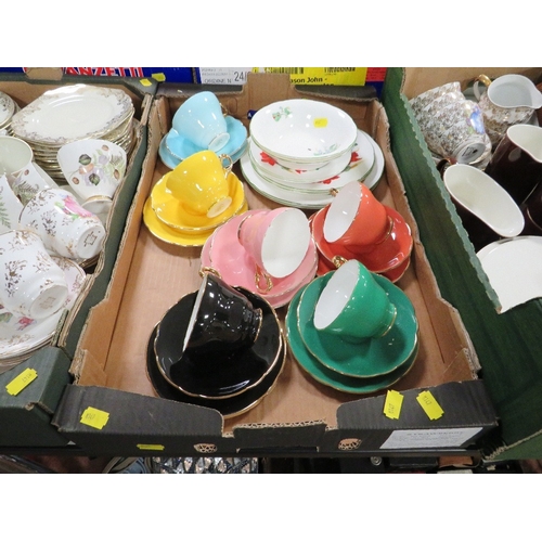 133 - Three trays of tea and dinnerware to include Harlequin cups and saucers, Poole etc