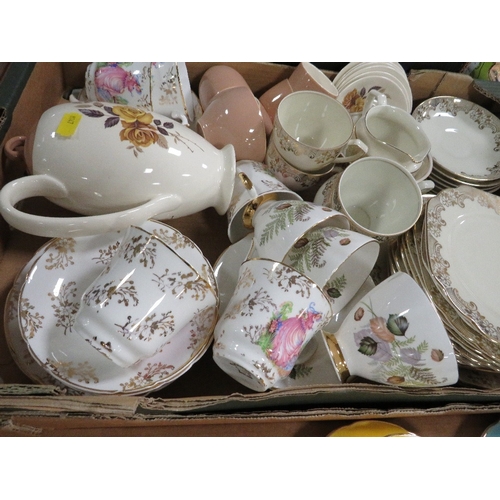 133 - Three trays of tea and dinnerware to include Harlequin cups and saucers, Poole etc