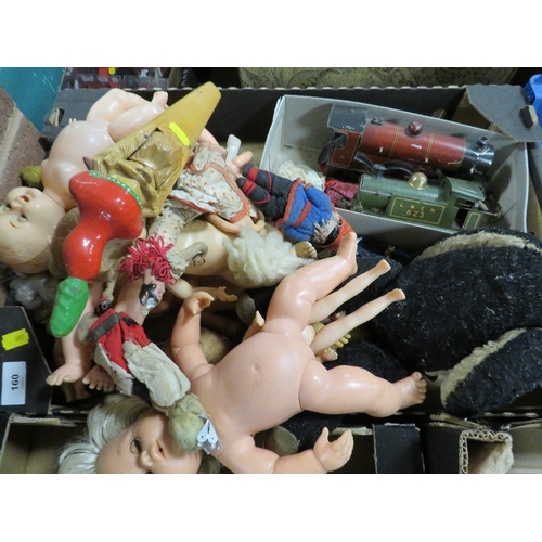 160 - A tray of toys to include two train engines, dolls etc